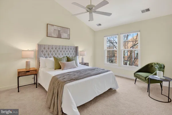 a bedroom with a bed and chair