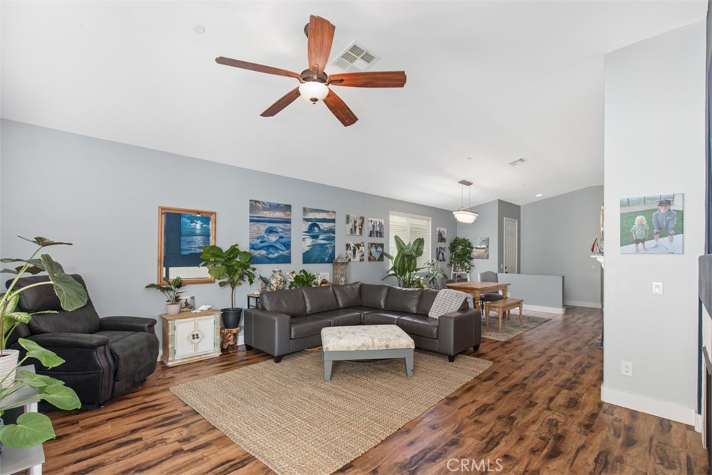 30307 Moon Star Circle Menifee, CA 92584 - Photo 15 of 53 a living room with furniture and a large window