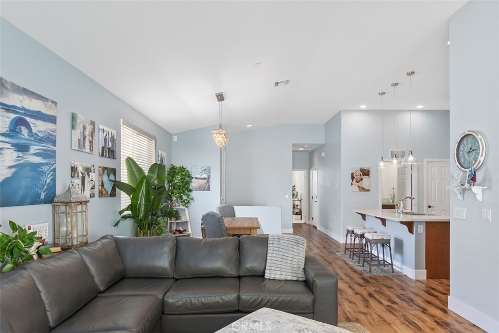 30307 Moon Star Circle Menifee, CA 92584 - Photo 17 of 53 a living room with furniture and a chandelier