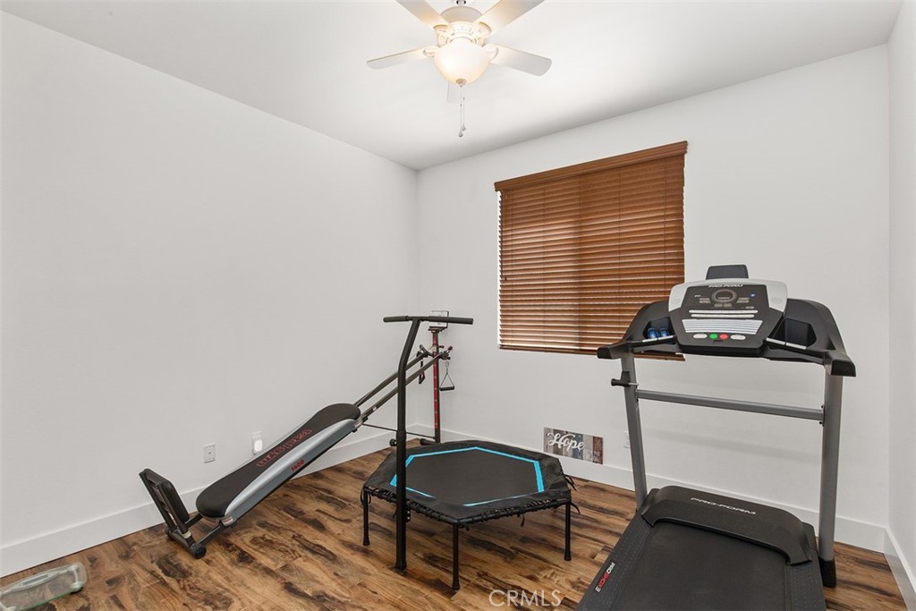 30307 Moon Star Circle Menifee, CA 92584 - Photo 26 of 53 a room with gym equipment