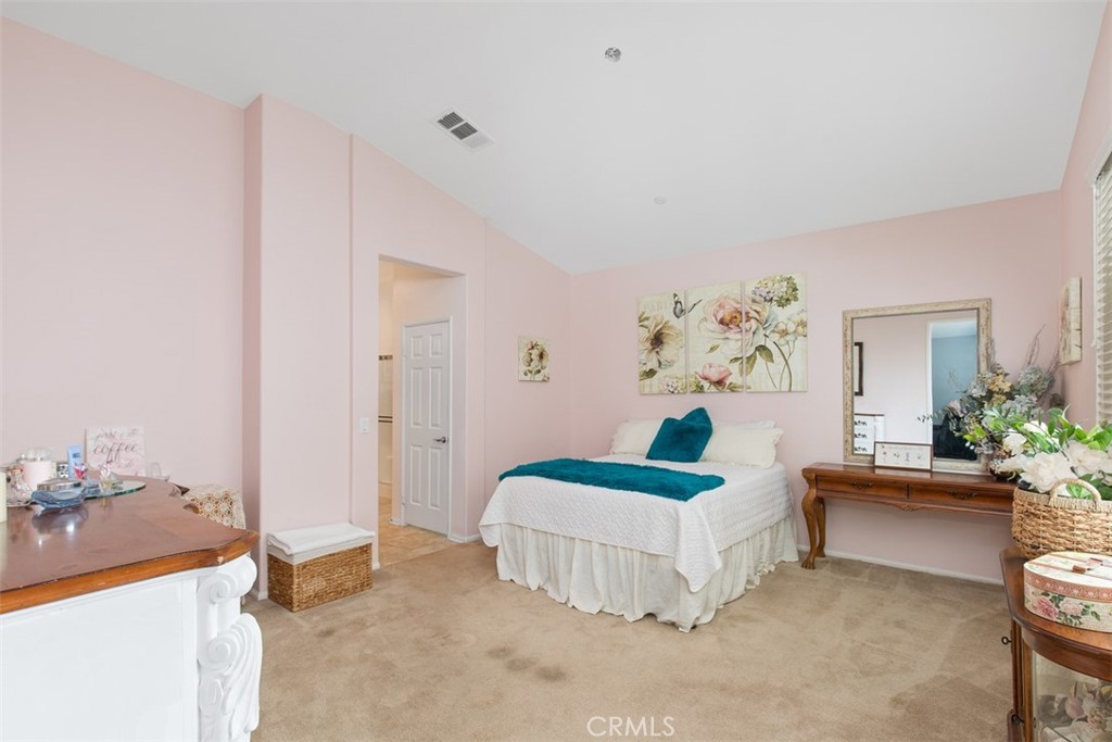 30307 Moon Star Circle Menifee, CA 92584 - Photo 27 of 53 a bedroom with a bed and a couch