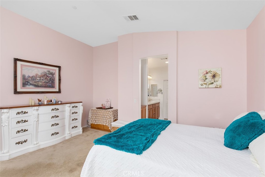 30307 Moon Star Circle Menifee, CA 92584 - Photo 29 of 53 a bedroom with a bed and a cabinets