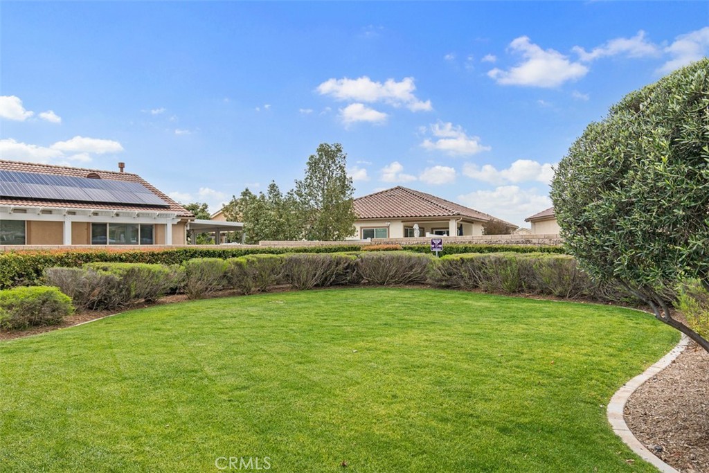 30307 Moon Star Circle Menifee, CA 92584 - Photo 47 of 53 a front view of a house with garden
