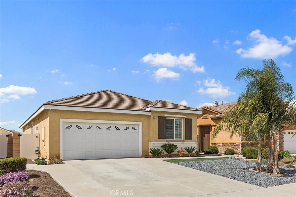 30307 Moon Star Circle Menifee, CA 92584 - Photo 7 of 53 a front view of a house with a yard