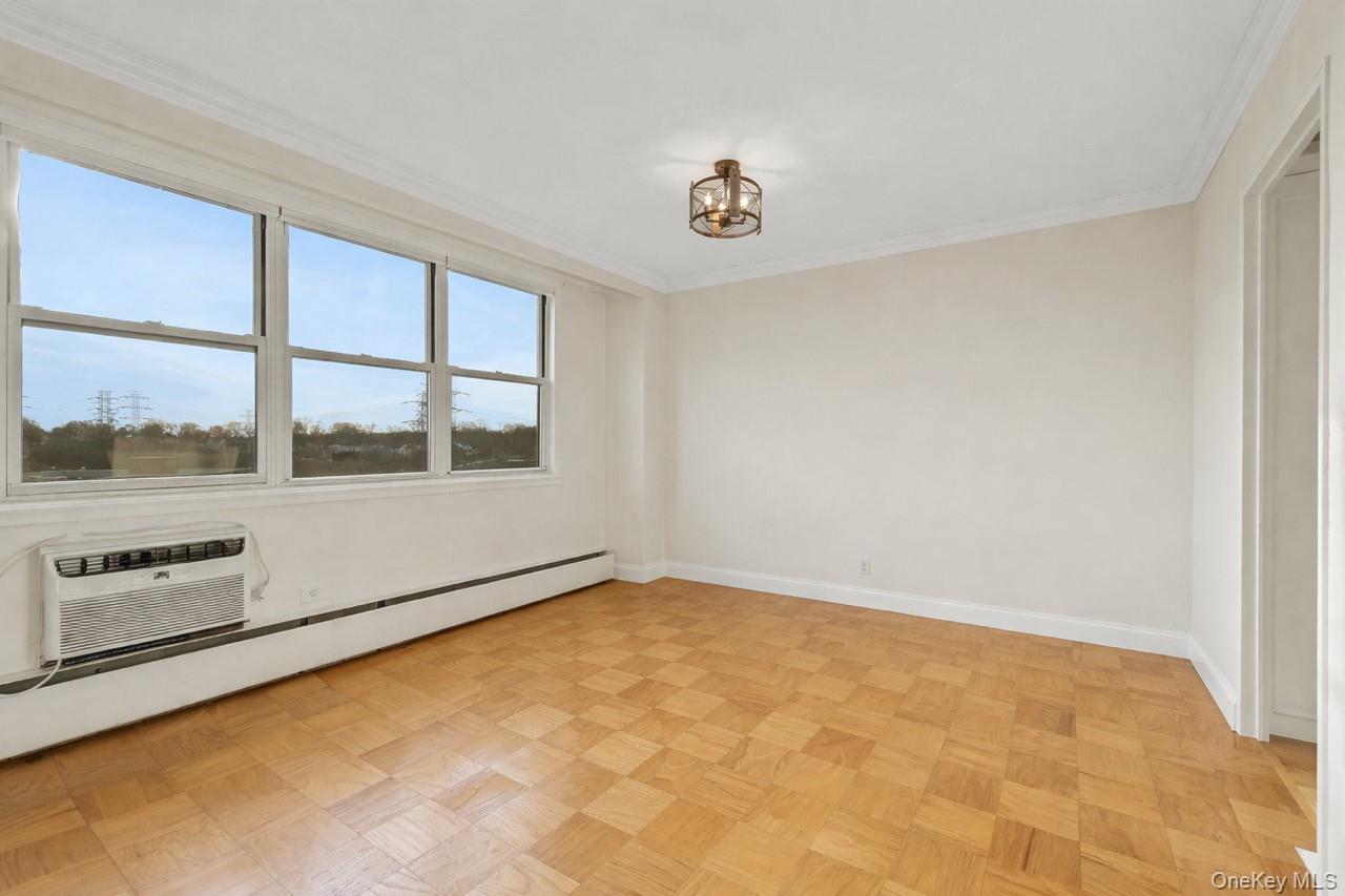 615 Palmer Road, Unit 1004 Yonkers, NY 10701 - Photo 11 of 21 Bright dining area with large windows showing entrance to the kitchen on the right.