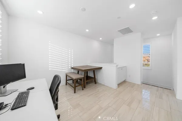 a view of a workspace with furniture