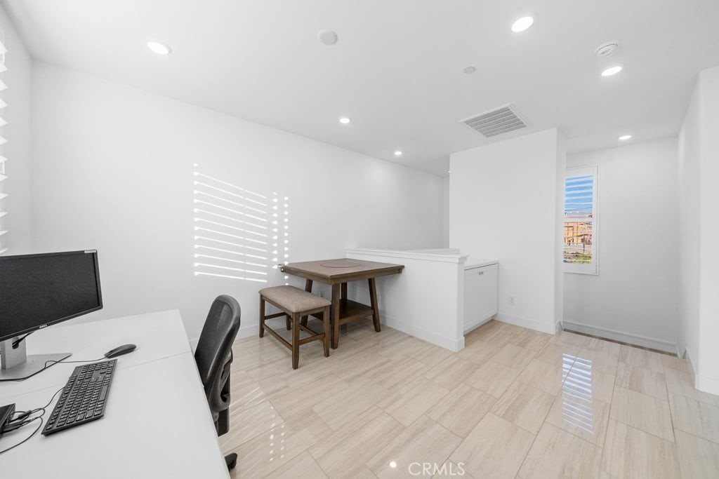 3040 Cove Street Rancho Mission Viejo, CA 92694 - Photo 13 of 44 a view of a workspace with furniture