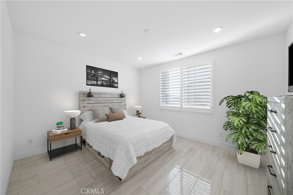 3040 Cove Street Rancho Mission Viejo, CA 92694 - Photo 15 of 44 a bedroom with a bed and a window