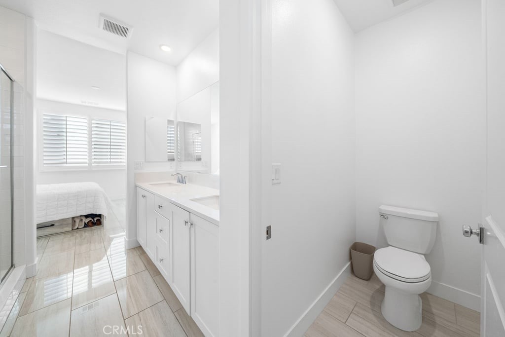 3040 Cove Street Rancho Mission Viejo, CA 92694 - Photo 19 of 44 a bathroom with a sink a toilet and a shower