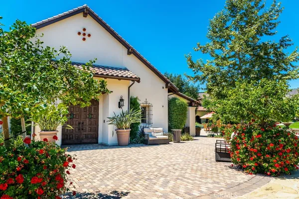 a view of a backyard with sitting area