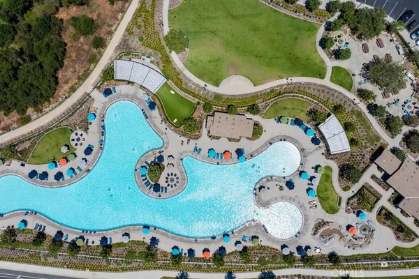 a room with large windows and view of dining room