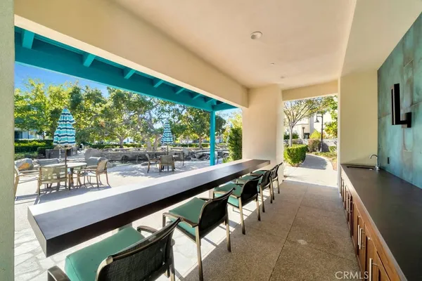 a view of a patio with a table and chairs