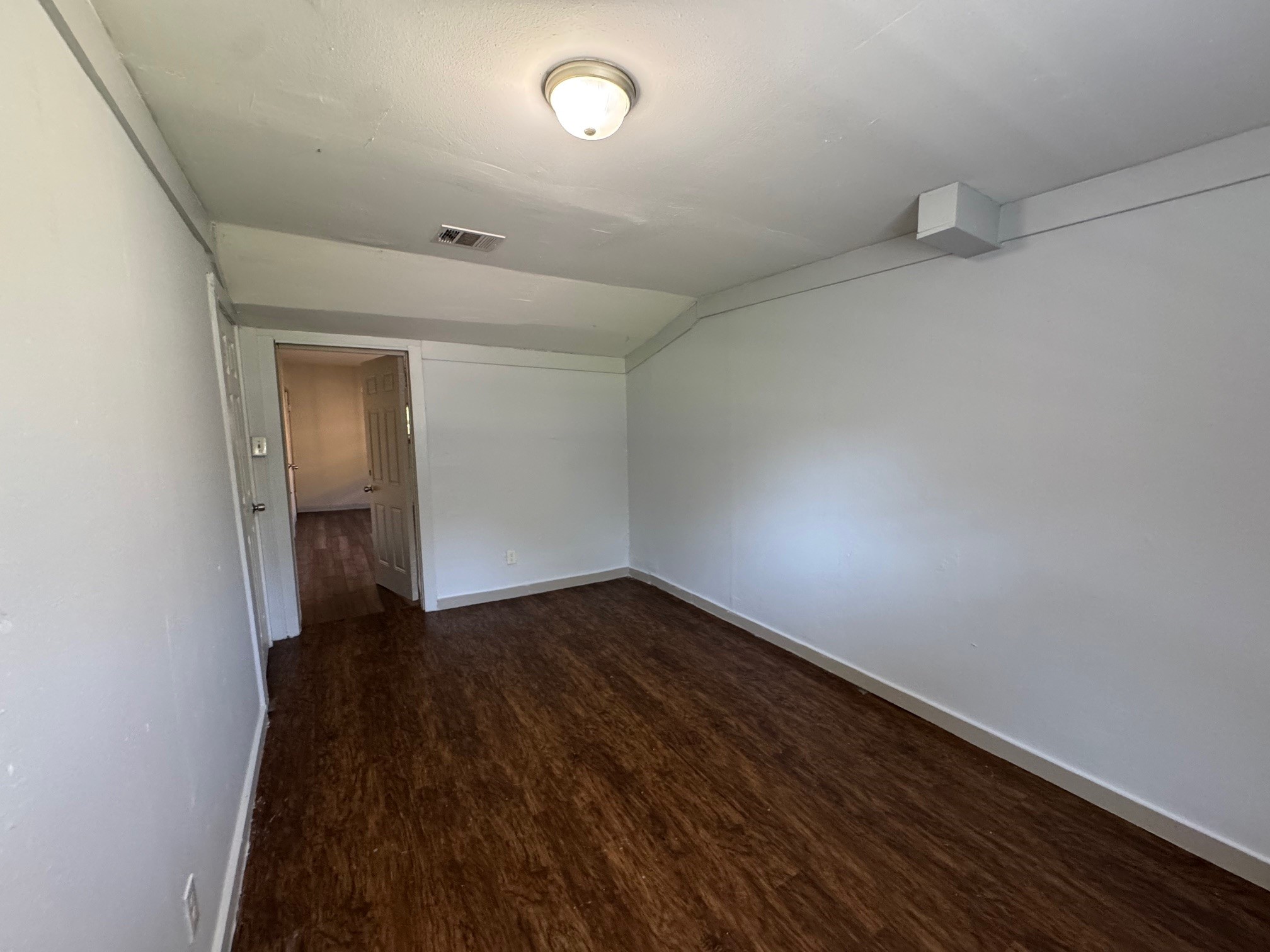 1104 Maple Street, Unit 2 La Marque, TX 77568 - Photo 5 of 16 an empty room with wooden floor and closet