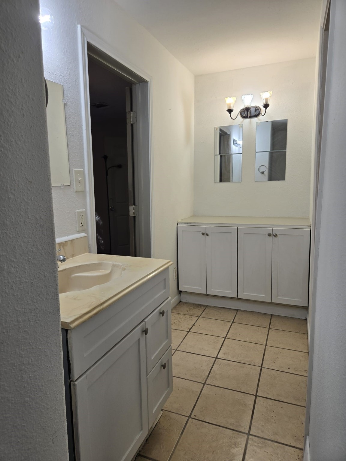 1104 Maple Street, Unit 2 La Marque, TX 77568 - Photo 8 of 16 a bathroom with a sink and a mirror