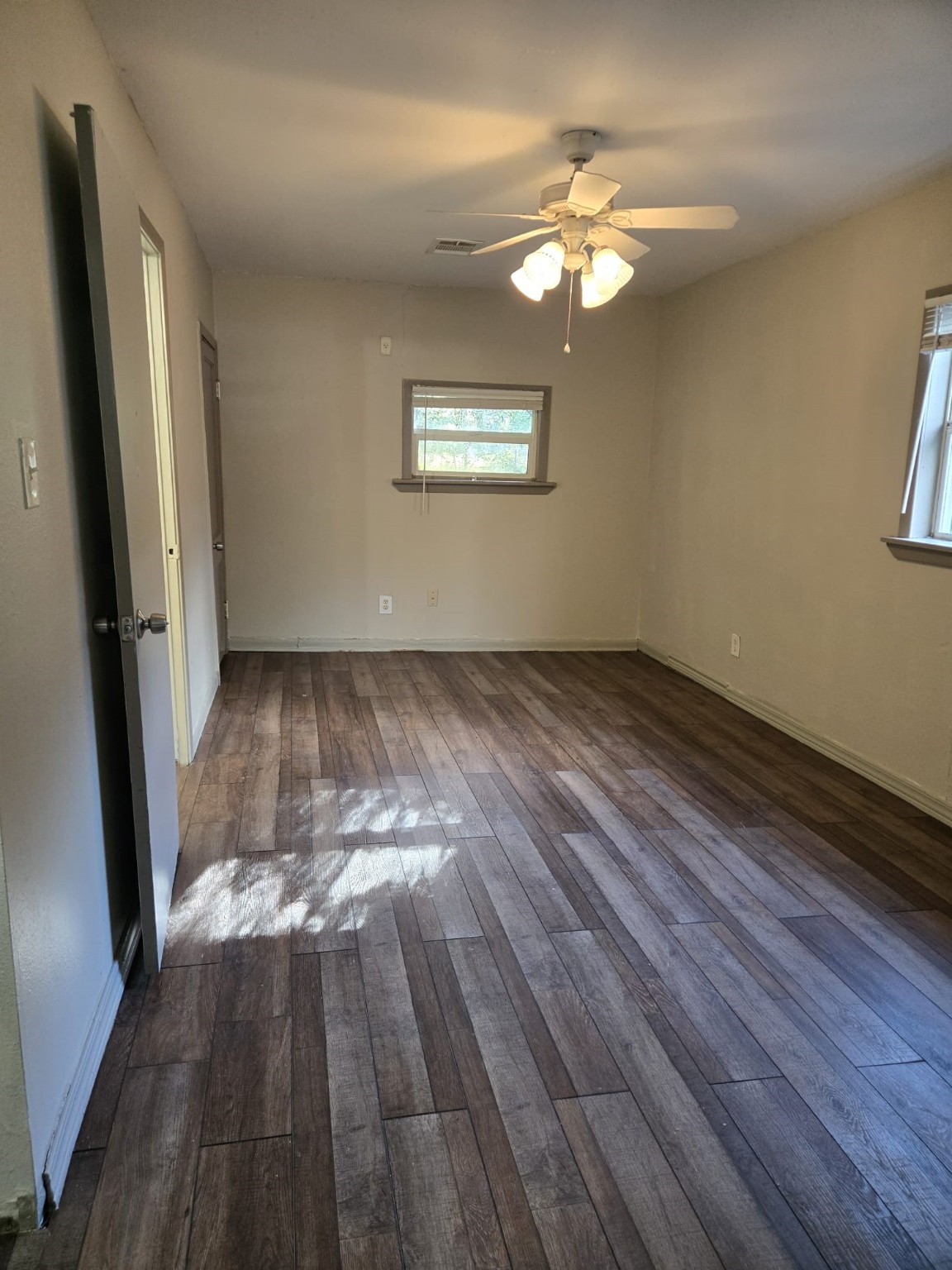 1104 Maple Street, Unit 2 La Marque, TX 77568 - Photo 10 of 16 wooden floor in an empty room with a window