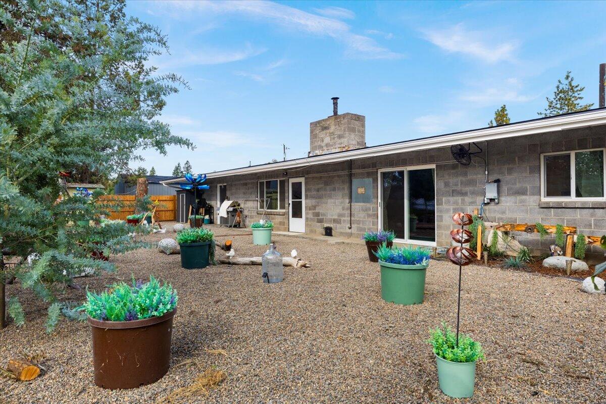 229 Gibbon Road Central Point, OR 97502 - Photo 24 of 25 a front view of a house with sitting area and garden