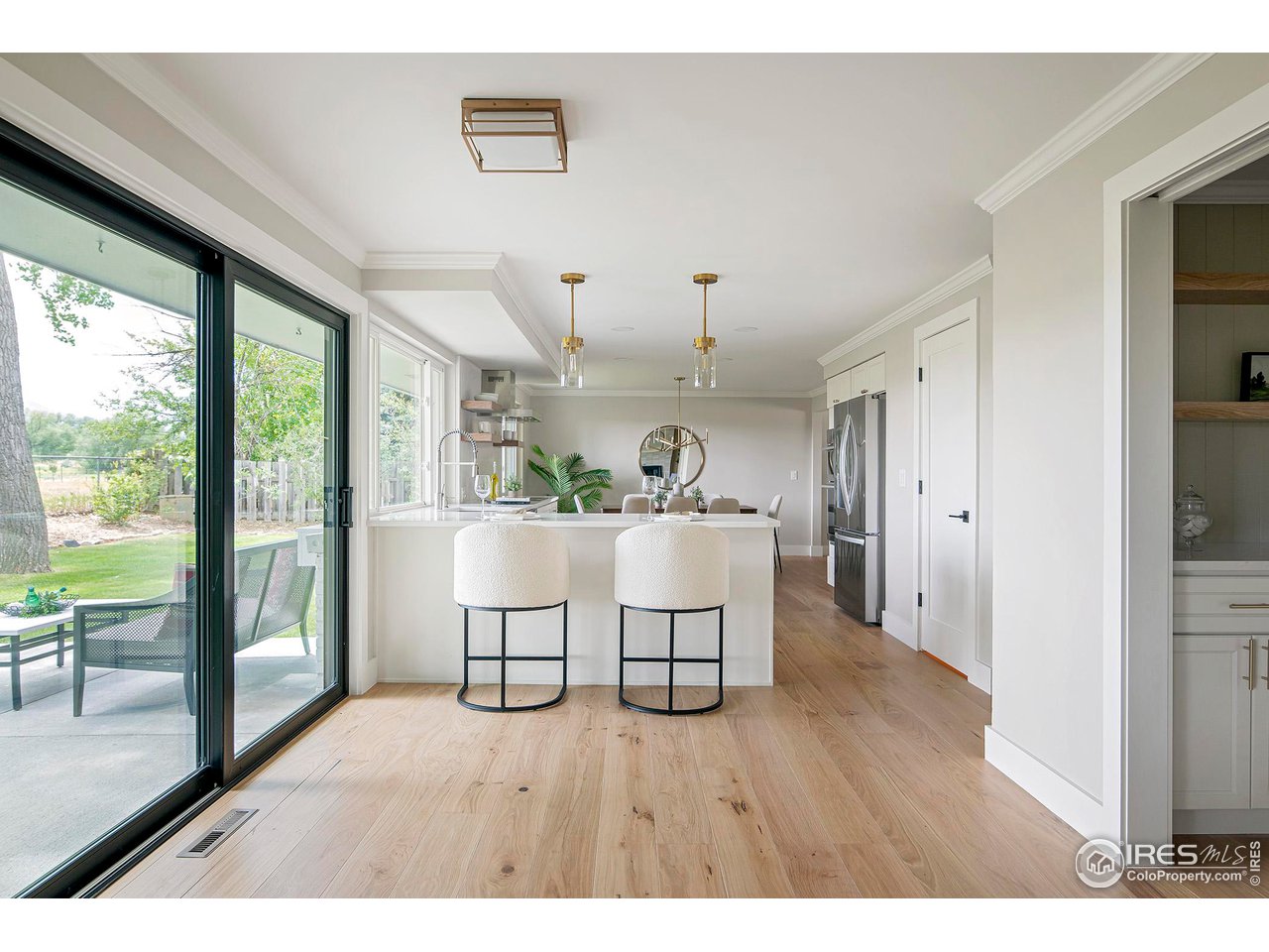6978 Carter Trail Boulder, CO 80301 - Photo 12 of 39 a open kitchen with furniture and wooden floor