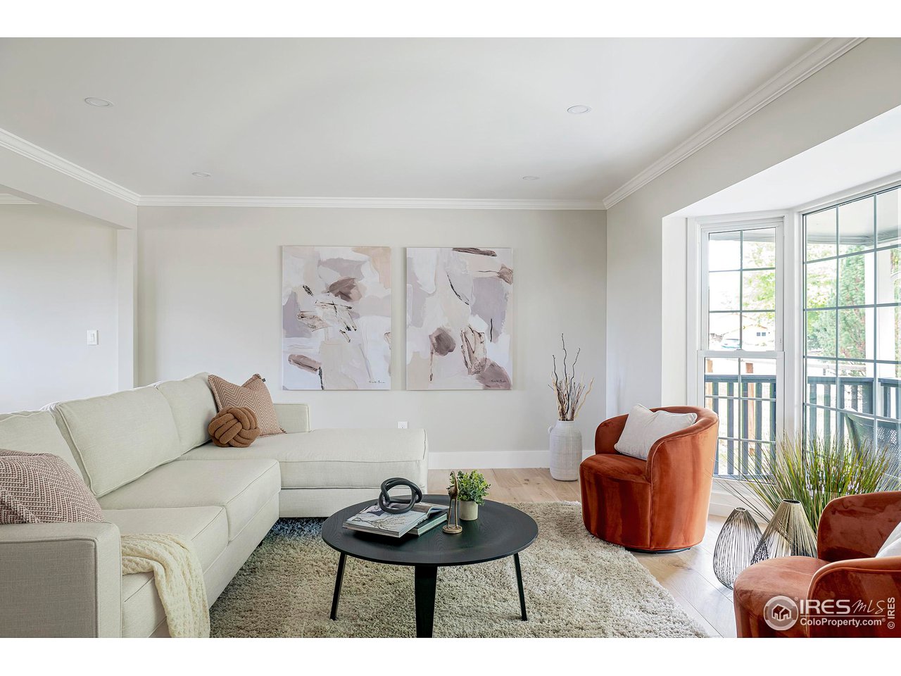 6978 Carter Trail Boulder, CO 80301 - Photo 19 of 39 a living room with furniture a couch and a large window