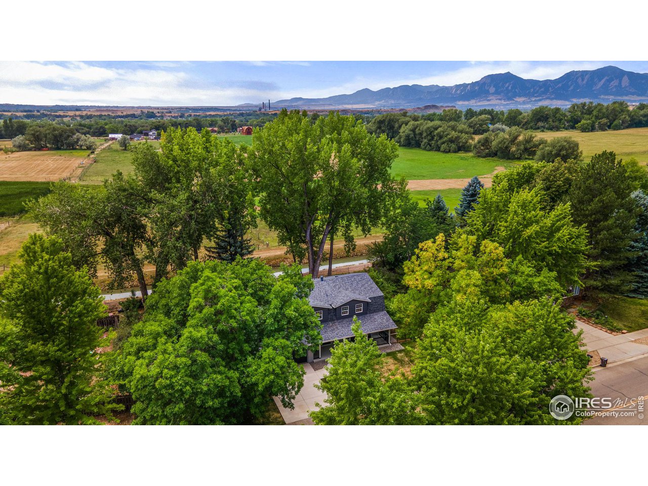 6978 Carter Trail Boulder, CO 80301 - Photo 2 of 39 a view of a lush green hillside and houses