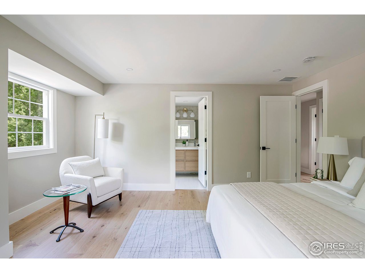 6978 Carter Trail Boulder, CO 80301 - Photo 21 of 39 a bedroom with a bed and a table