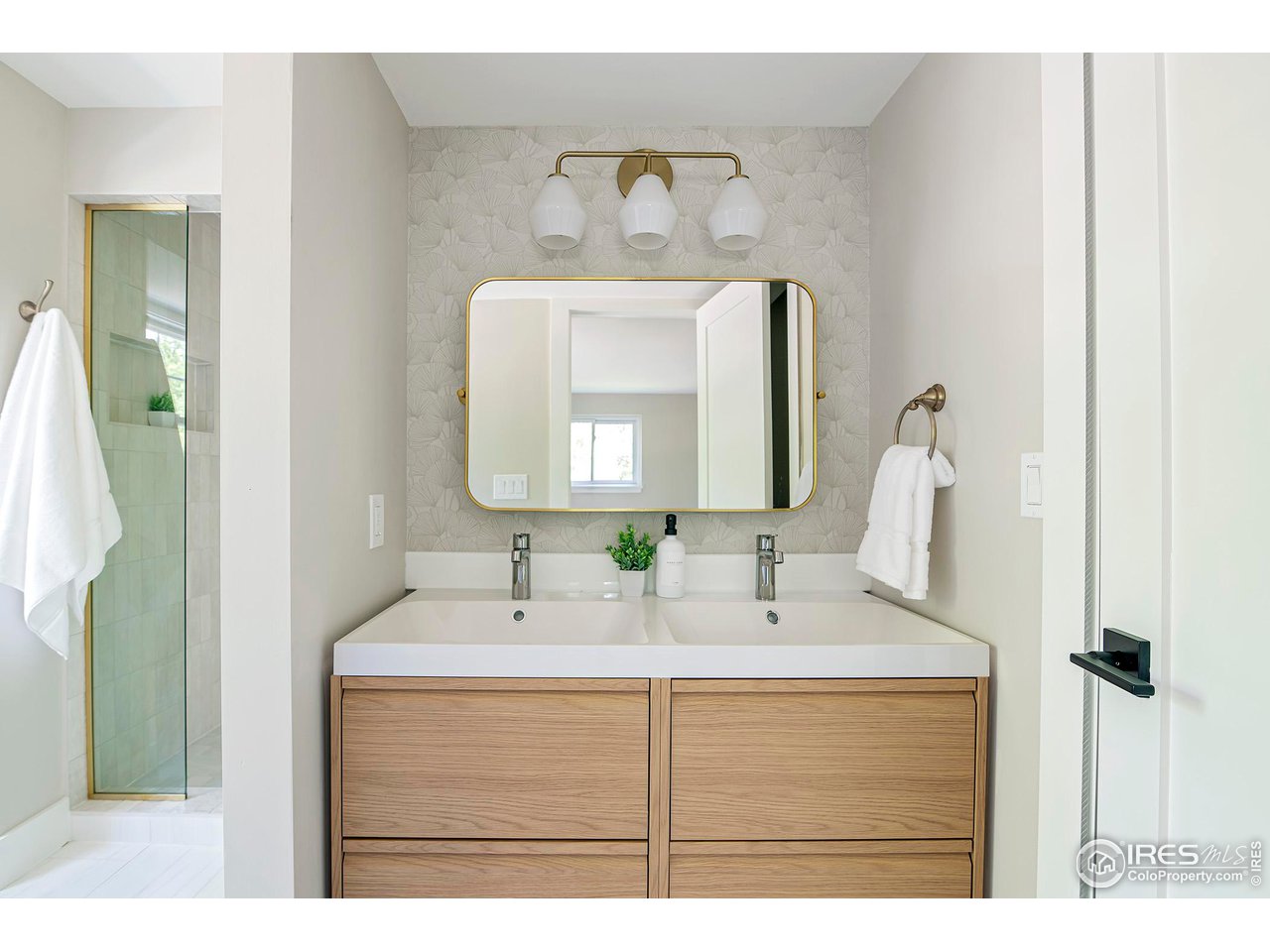 6978 Carter Trail Boulder, CO 80301 - Photo 23 of 39 a bathroom with a sink vanity and a mirror