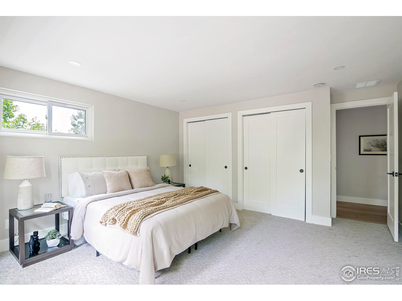6978 Carter Trail Boulder, CO 80301 - Photo 25 of 39 a bedroom with a bed and a painting