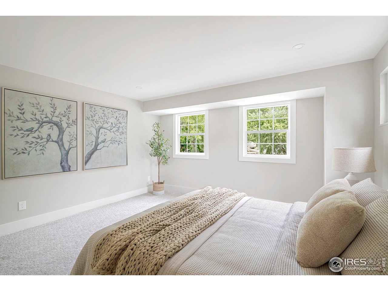 6978 Carter Trail Boulder, CO 80301 - Photo 26 of 39 a bedroom with a bed and a painting on the wall