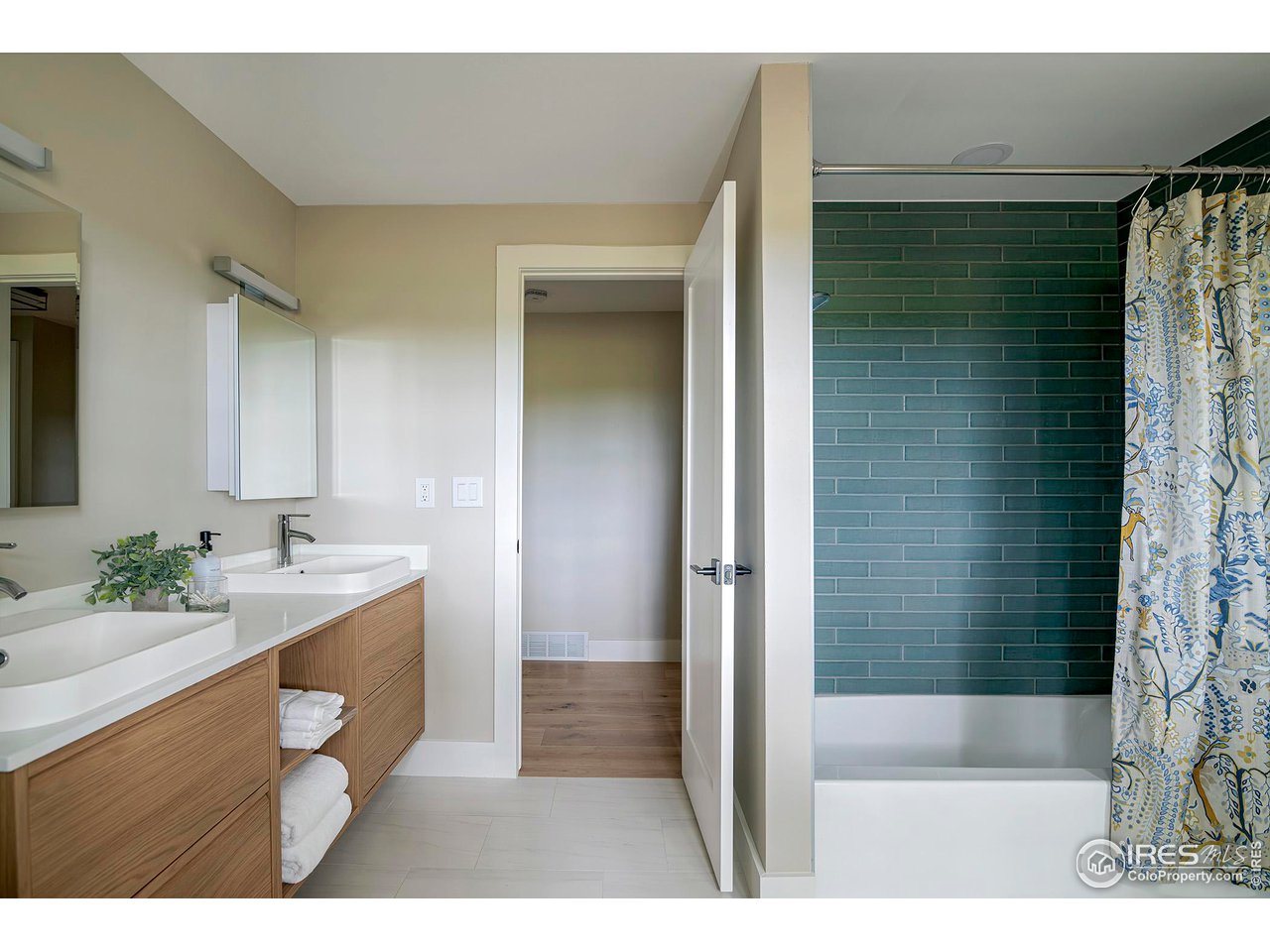 6978 Carter Trail Boulder, CO 80301 - Photo 30 of 39 a bathroom with a sink a toilet and shower