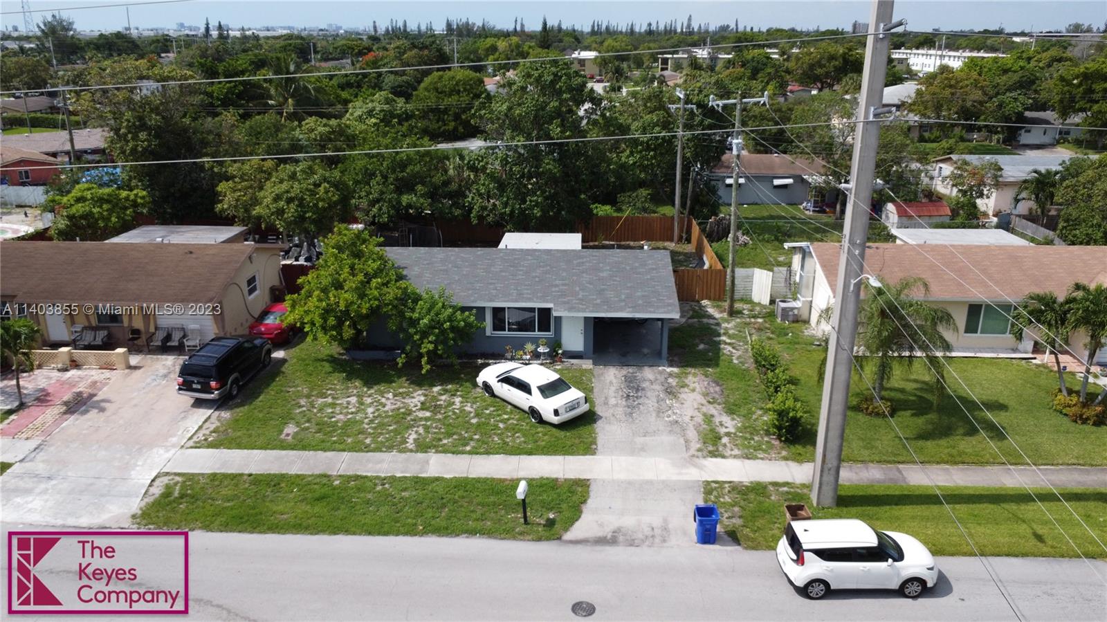 700 Southwest 14th Street Deerfield Beach, FL 33441 - Photo 2 of 6 an aerial view of a house with garden space lake view and mountain view in back