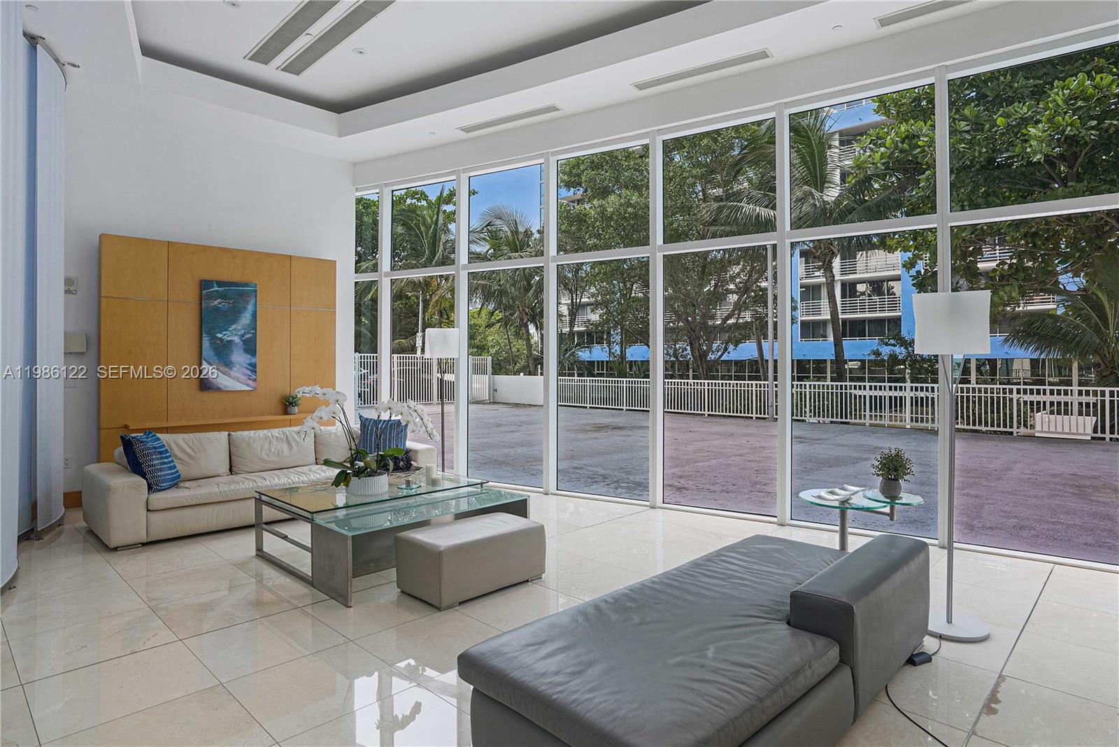 2101 Brickell Avenue, Unit 2102 Miami, FL 33129 - Photo 18 of 29 a living room with furniture and a large window