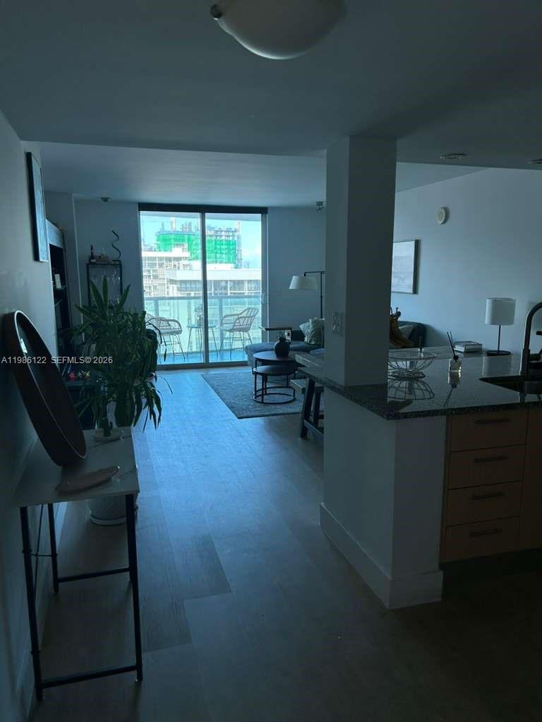 2101 Brickell Avenue, Unit 2102 Miami, FL 33129 - Photo 25 of 29 a living room with furniture and large windows