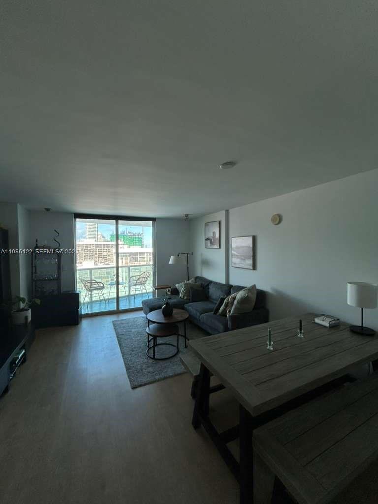 2101 Brickell Avenue, Unit 2102 Miami, FL 33129 - Photo 26 of 29 a living room with furniture and a open window
