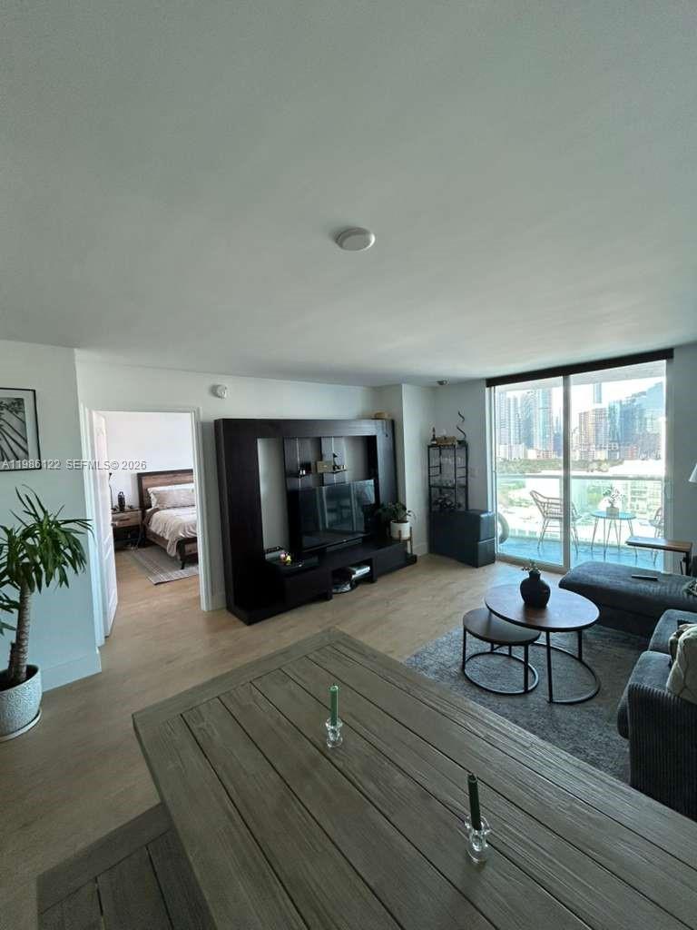 2101 Brickell Avenue, Unit 2102 Miami, FL 33129 - Photo 27 of 29 a living room with furniture and a flat screen tv