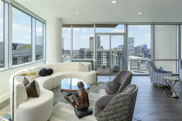 a living room with furniture and a large window