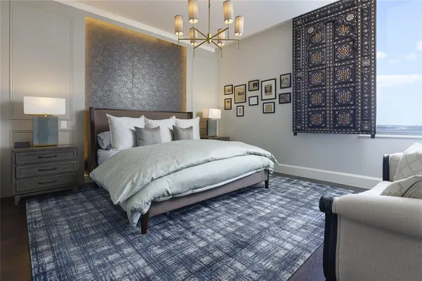a bedroom with a bed dresser and a window