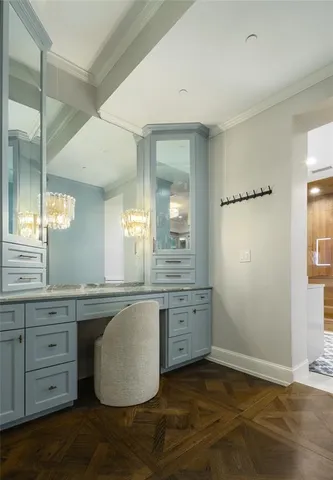 a bathroom with a granite countertop sink a mirror and a bathtub