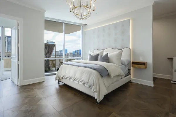 a spacious bedroom with a bed and a window