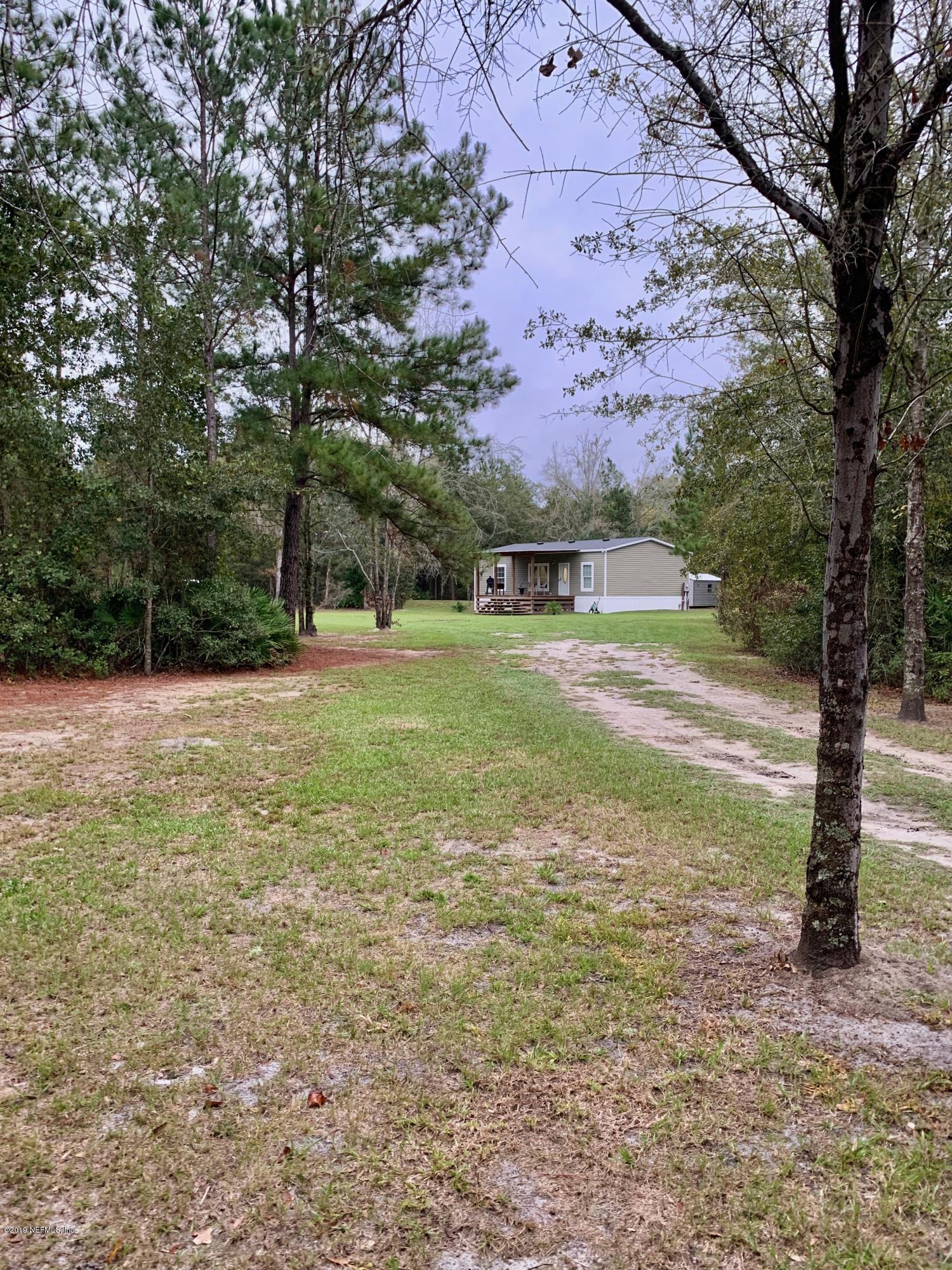 14227 Southwest 151st Avenue Brooker, FL 32622 - Photo 1 of 9 a view of a field with trees in the background