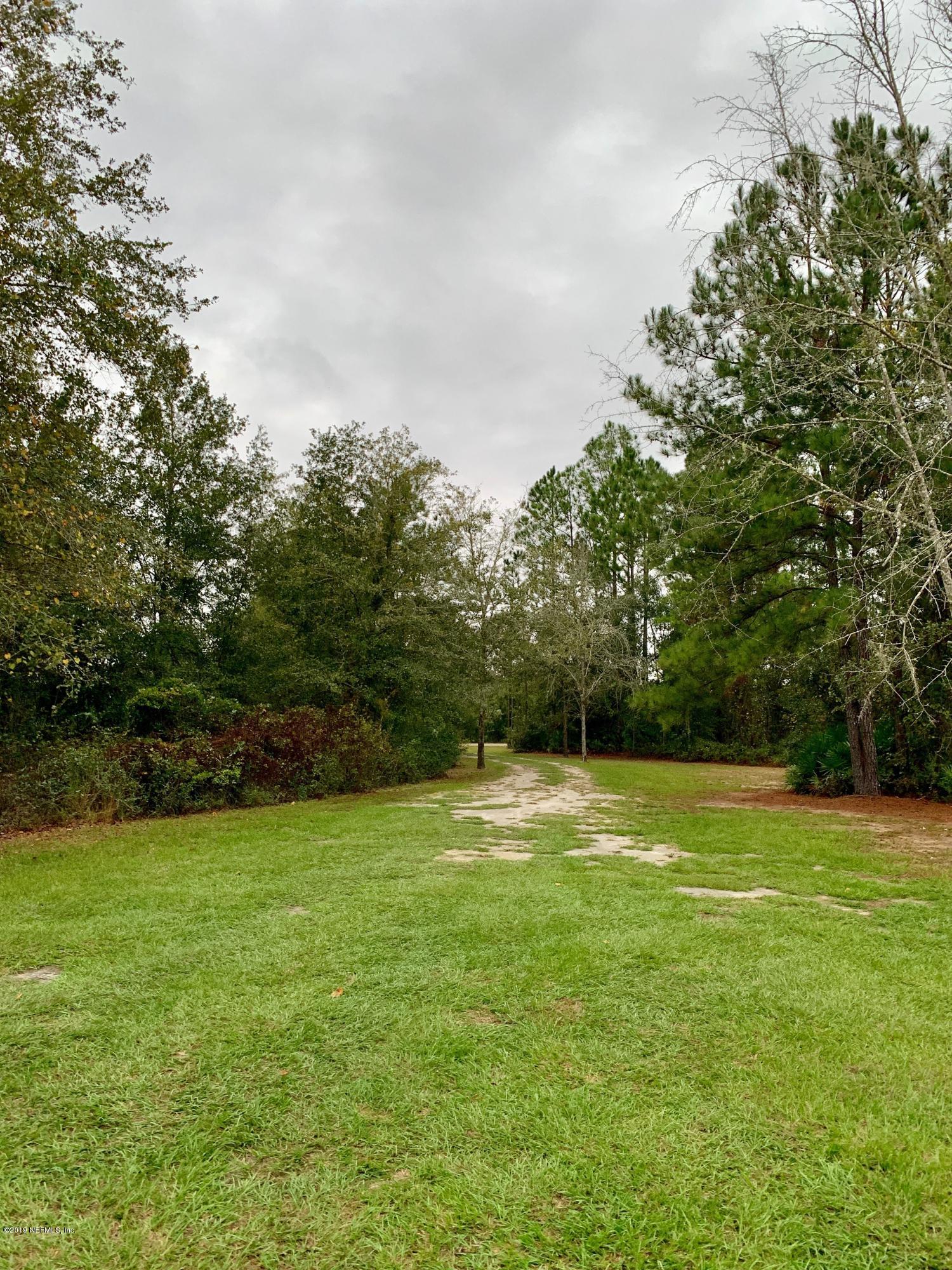 14227 Southwest 151st Avenue Brooker, FL 32622 - Photo 9 of 9 a view of a big yard with an trees