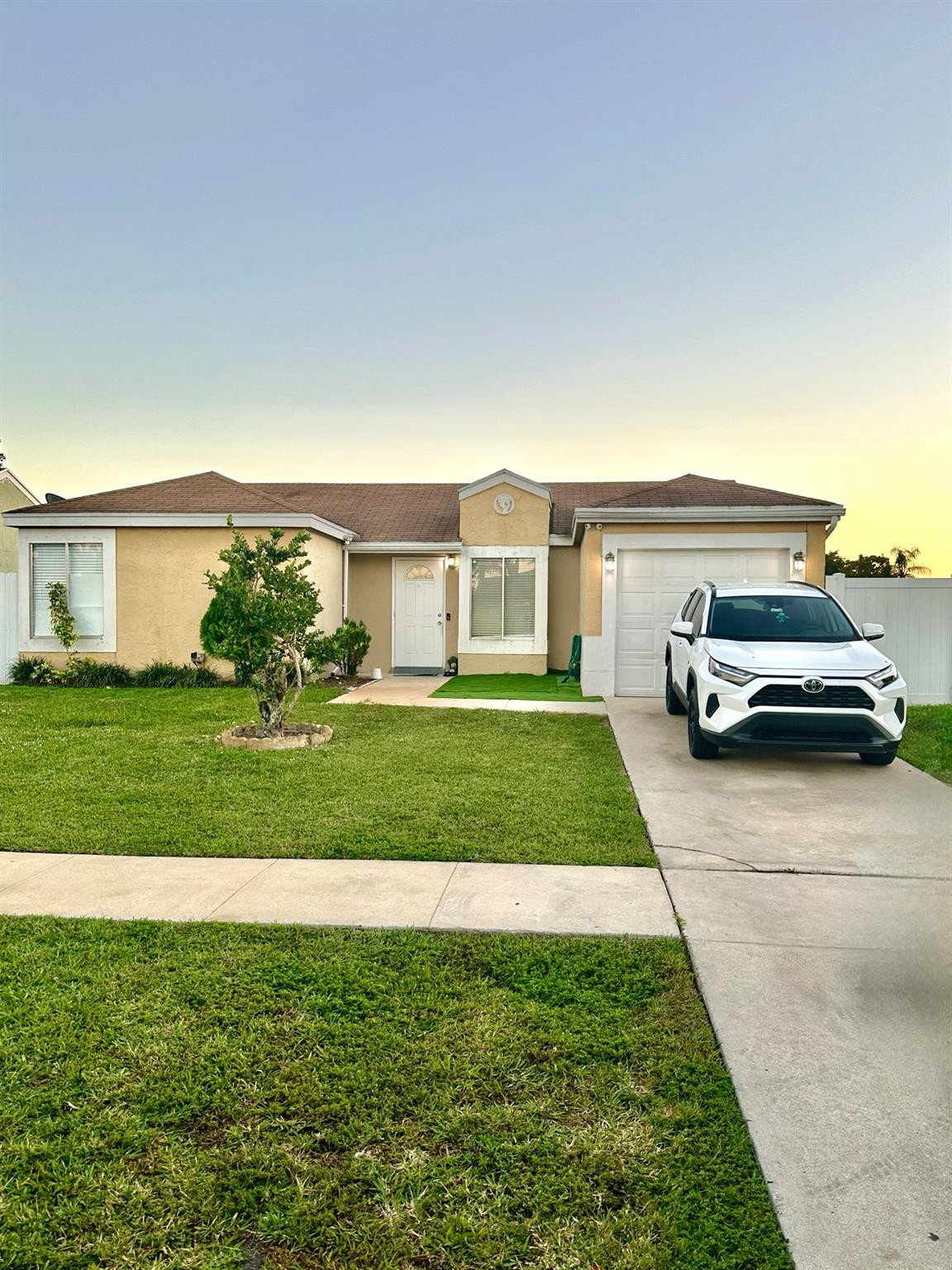 18814 Cloud Lake Circle Boca Raton, FL 33496 - Photo 1 of 19 a front view of a house with a yard