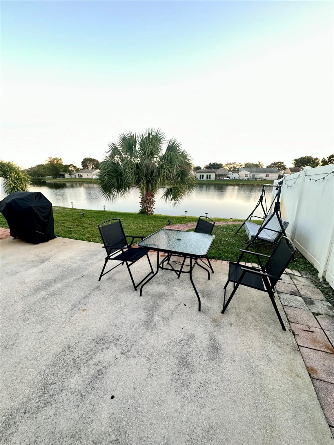 18814 Cloud Lake Circle Boca Raton, FL 33496 - Photo 17 of 19 a view of a lake with table and chairs