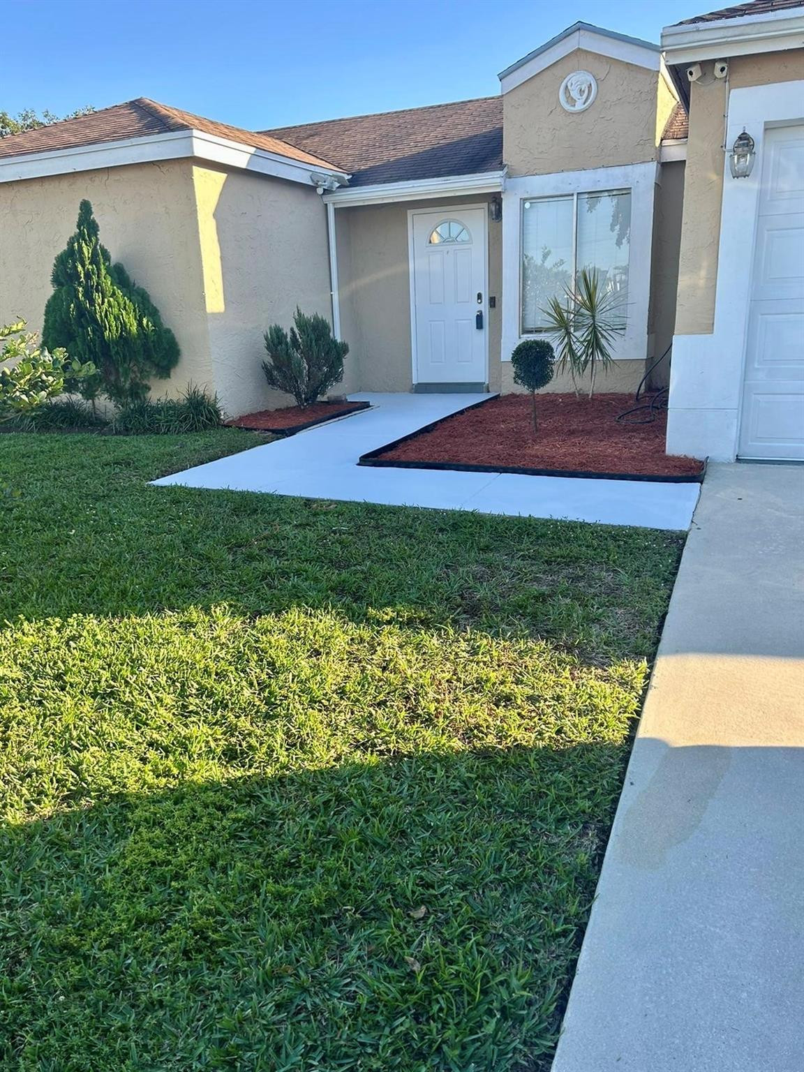 18814 Cloud Lake Circle Boca Raton, FL 33496 - Photo 2 of 19 a view of backyard with a garden and plants