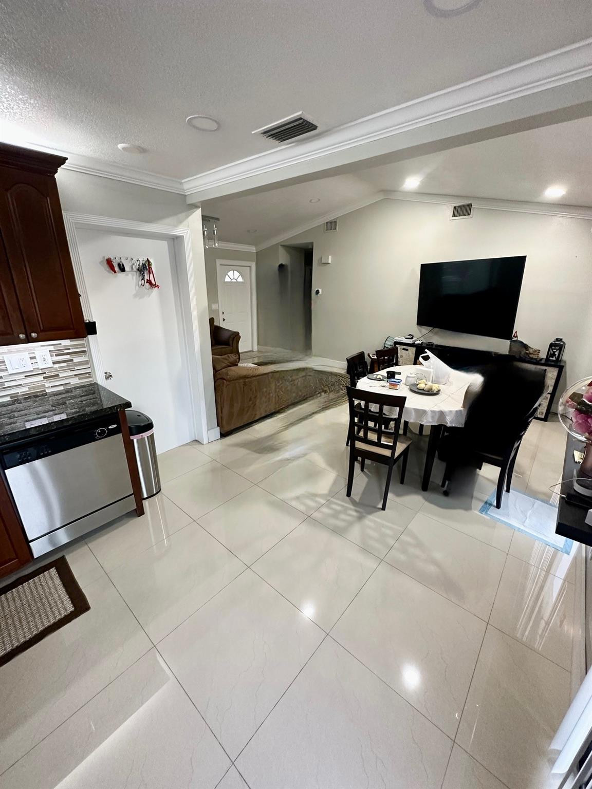18814 Cloud Lake Circle Boca Raton, FL 33496 - Photo 5 of 19 a living room with furniture and a flat screen tv