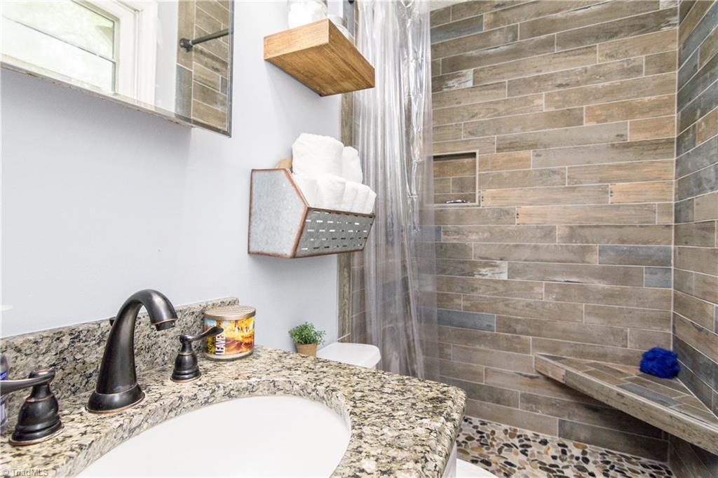 1661 Danny Bell Road Asheboro, NC 27205 - Photo 14 of 25 Master bathroom with new tile shower less than a month old.