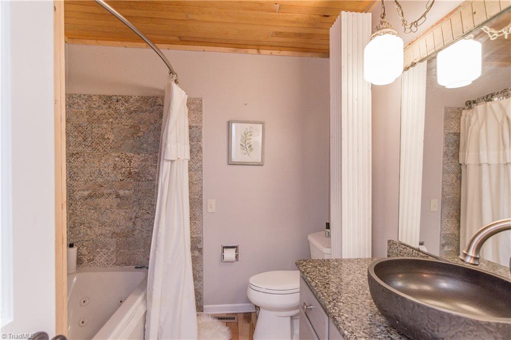 1661 Danny Bell Road Asheboro, NC 27205 - Photo 18 of 25 Updated 2nd bathroom. Amazing tile work around the tub.