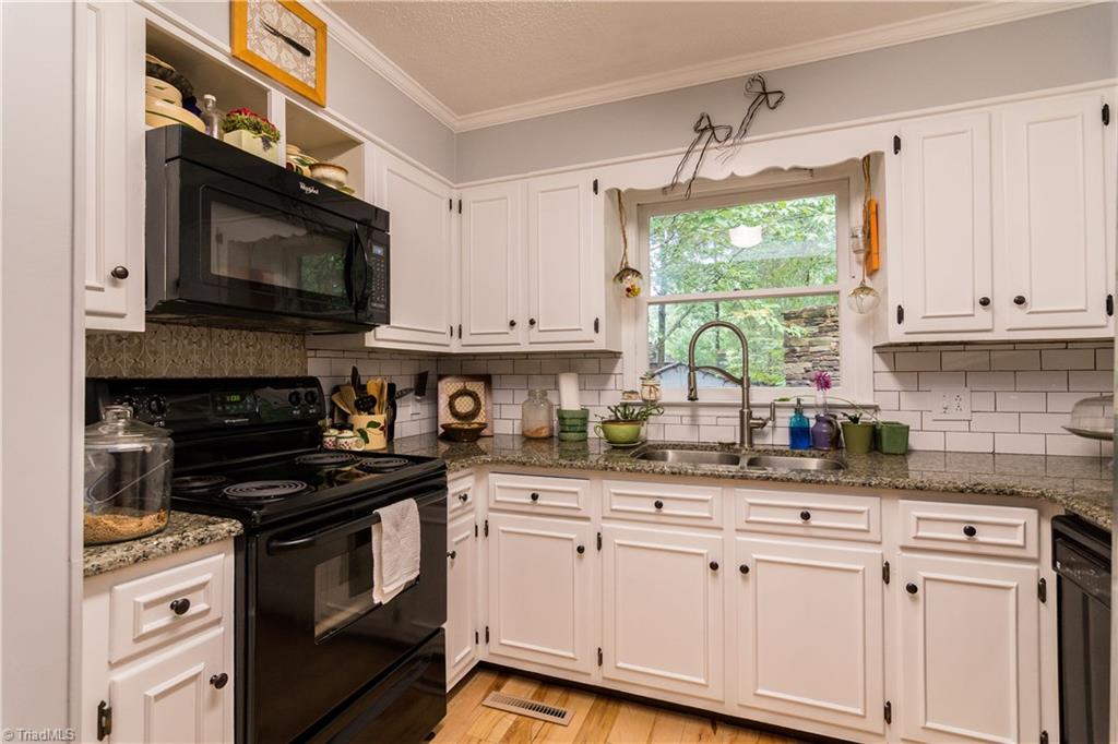 1661 Danny Bell Road Asheboro, NC 27205 - Photo 10 of 25 Updated kitchen with brand new knobs and hinges.