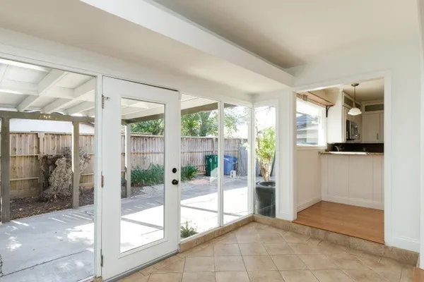 a view of a entryway door and an empty room