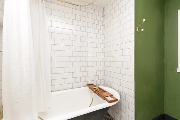 a bathroom with a shower and a bathtub