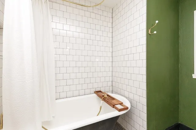 a bathroom with a shower and a bathtub