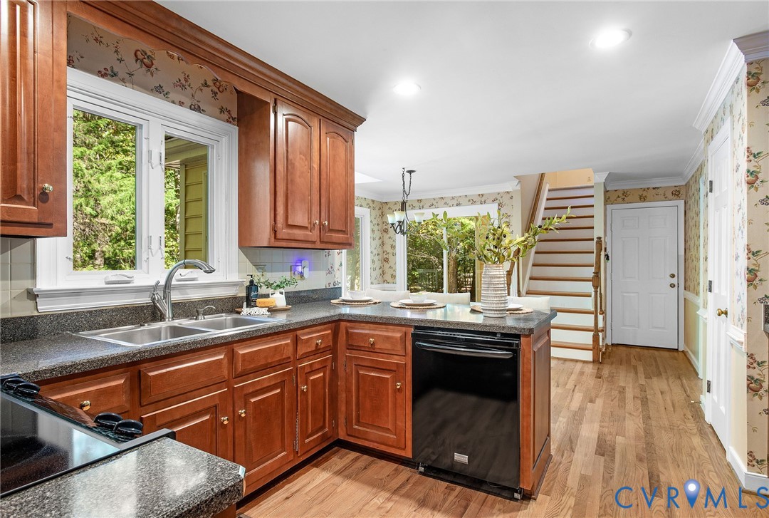 15010 Walnut Bend Road Midlothian, VA 23112 - Photo 12 of 35 a kitchen with a sink stove and cabinets